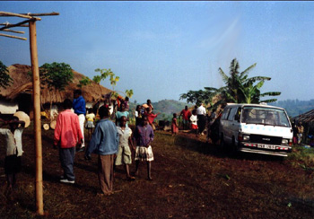 We arrive at Karikajunga for village ministry (in the white van).  Where is the road, you ask?  What road?